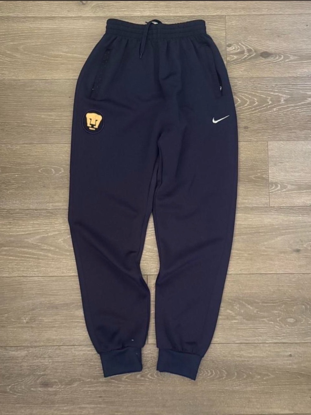 Nike Kids Black Joggers with Yellow Patch and White Swoosh